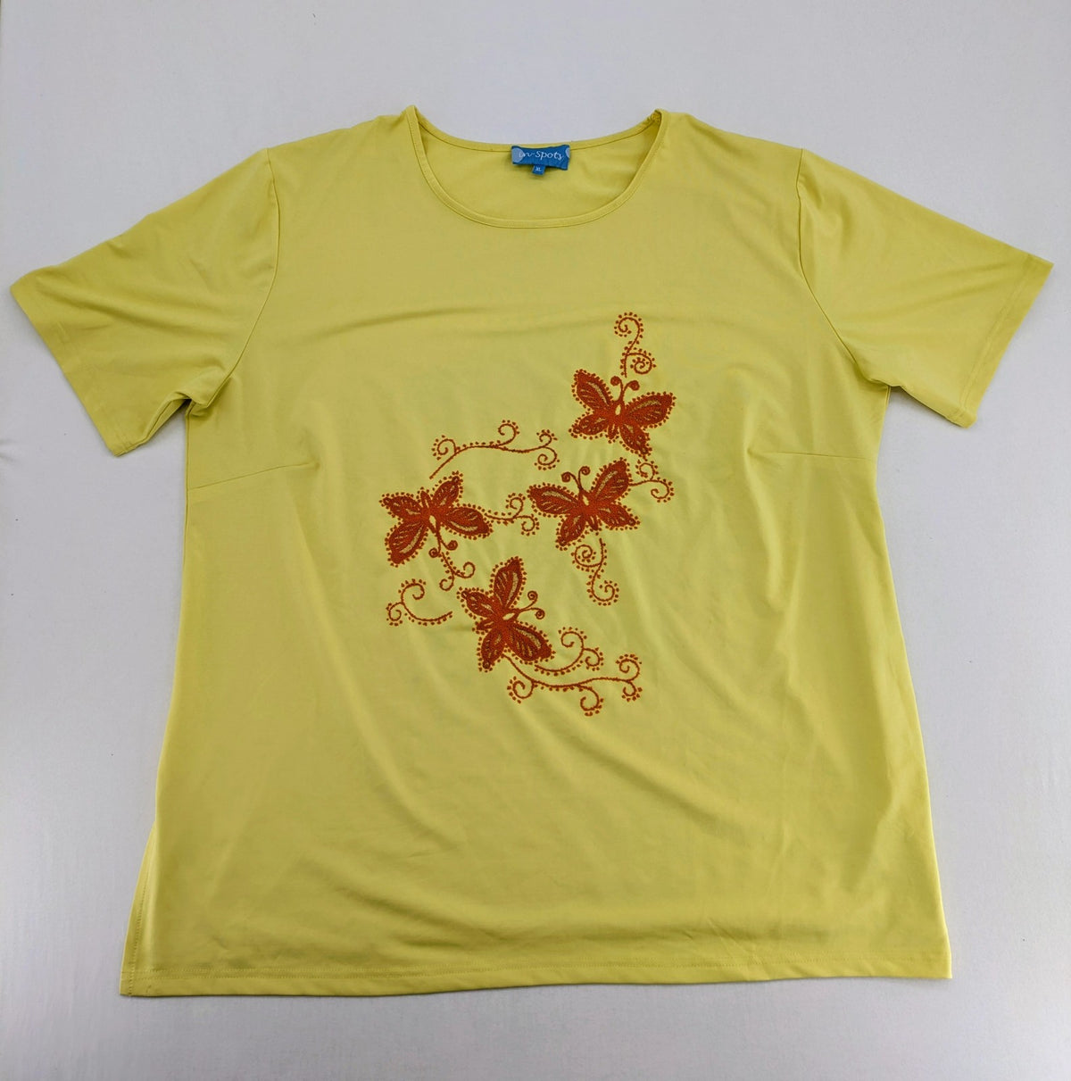 in-Spots yellow t-shirt with butterfly glitter graphic and textured bead details