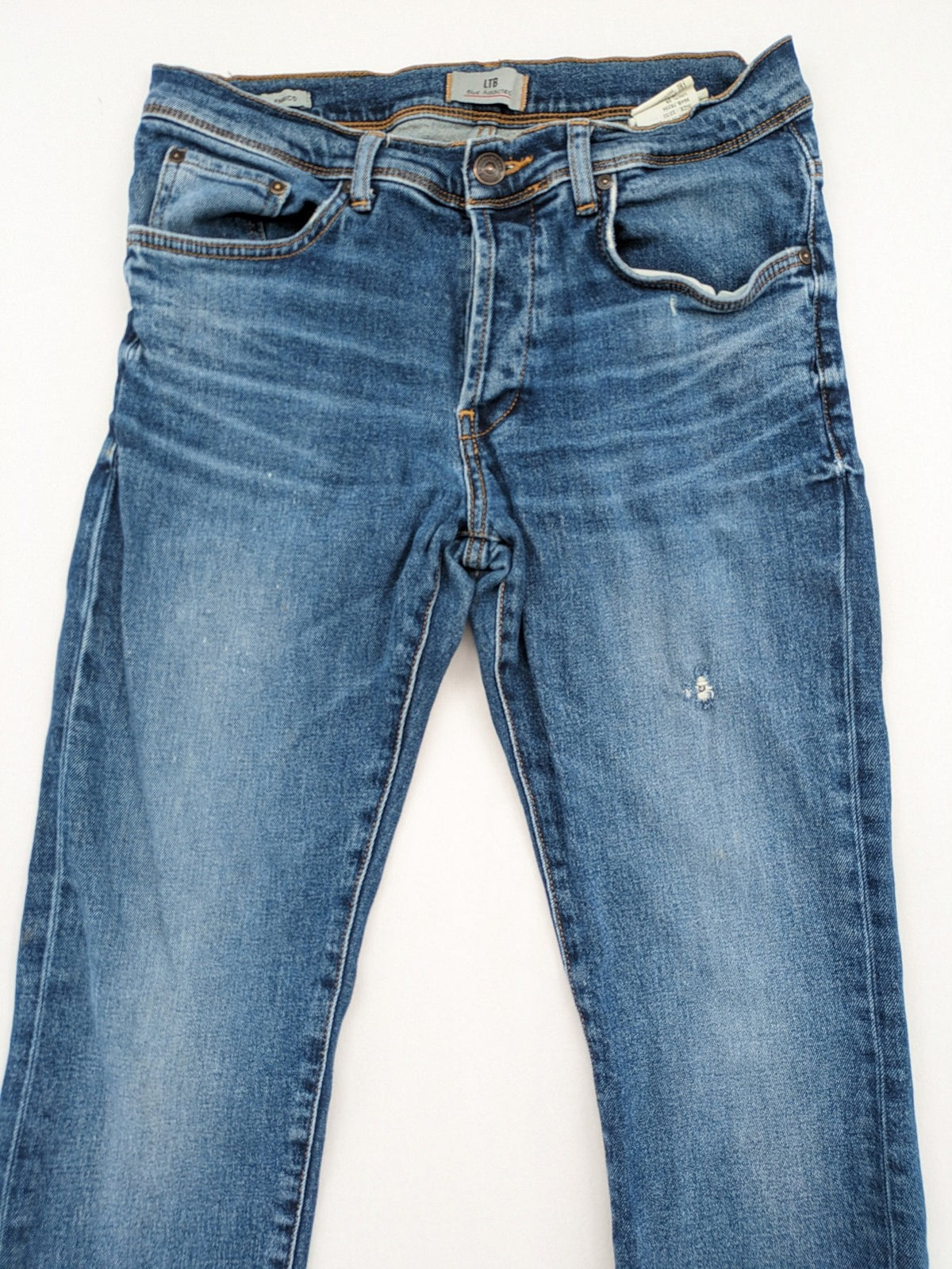 LTB blue straight jeans with low rise, button fly, and classic denim wash.