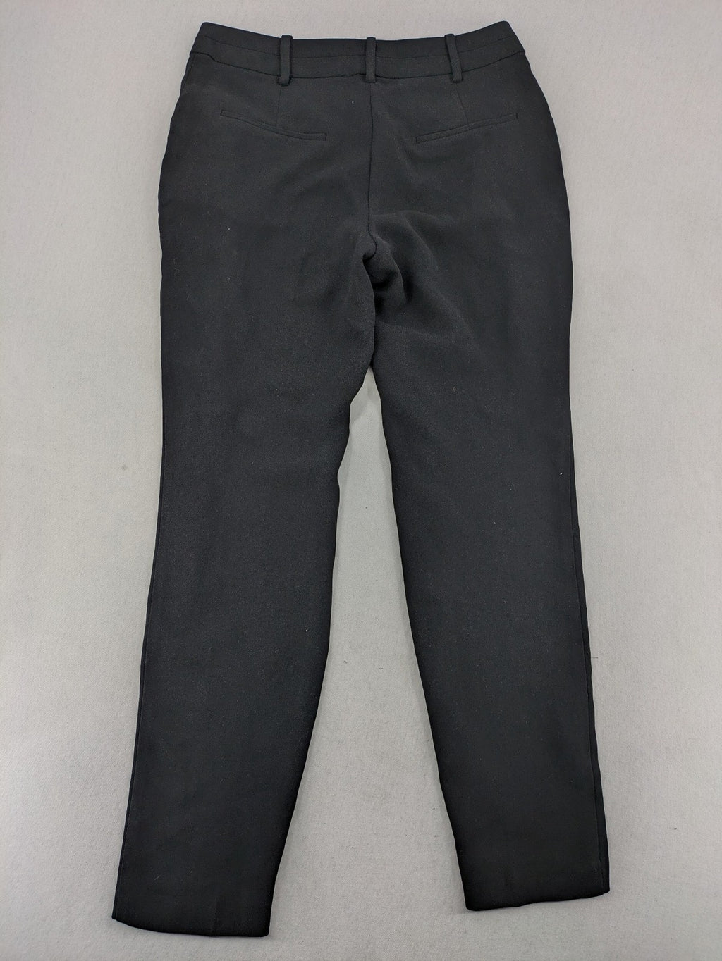 Mango Suit black trousers with zipper, belt loops, and front slant pockets.