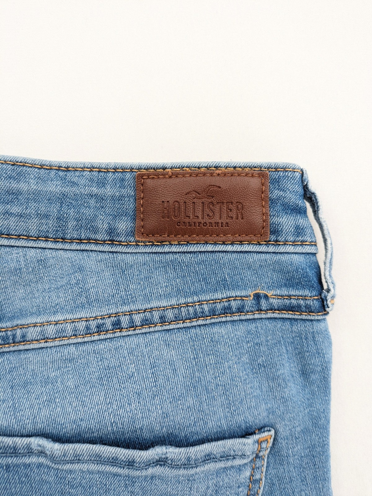 Hollister blue high rise super skinny jeans with frayed hem and classic stretch denim.