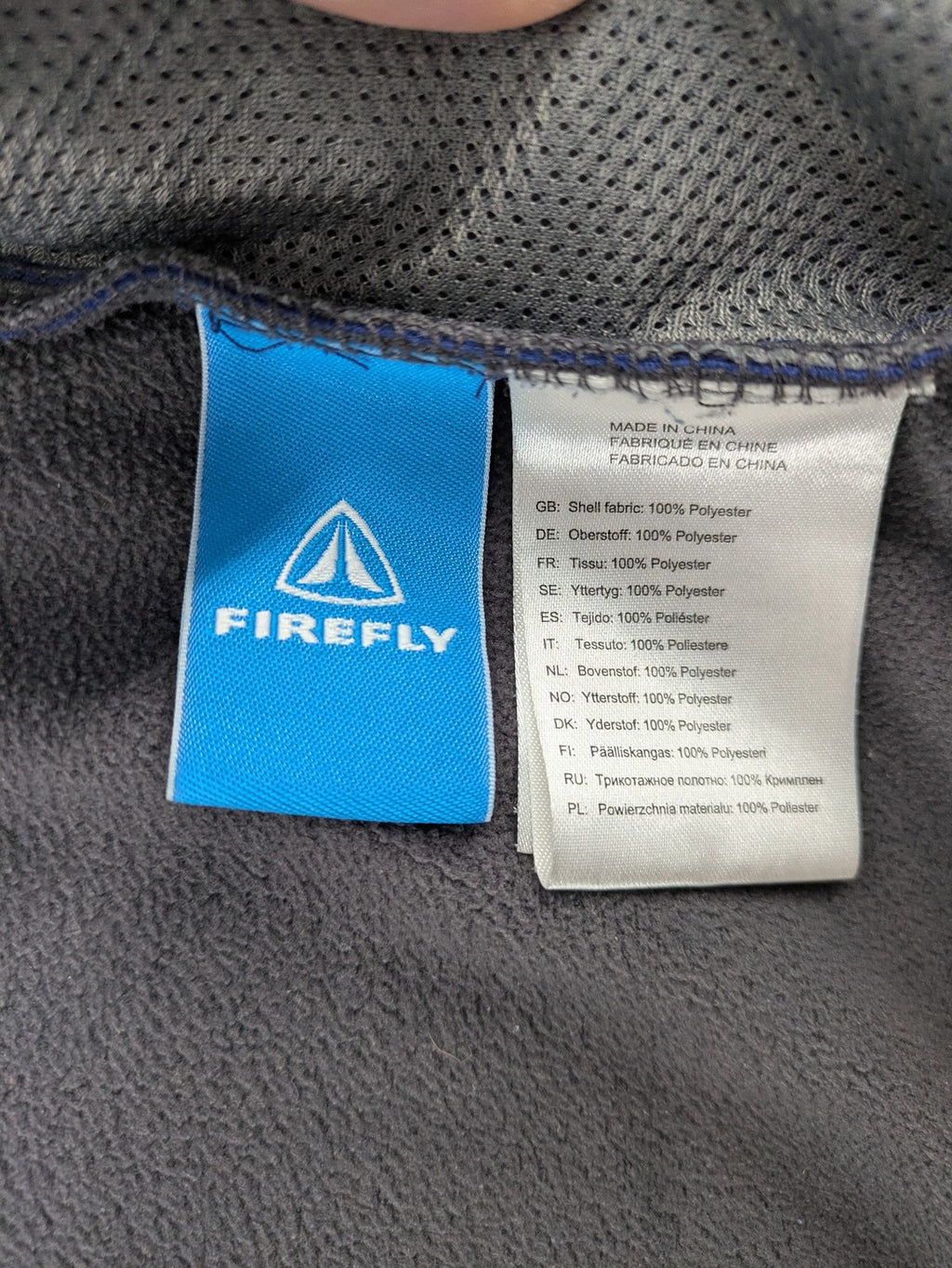 Firefly blue softshell jacket with adjustable hood and prominent chest logo.