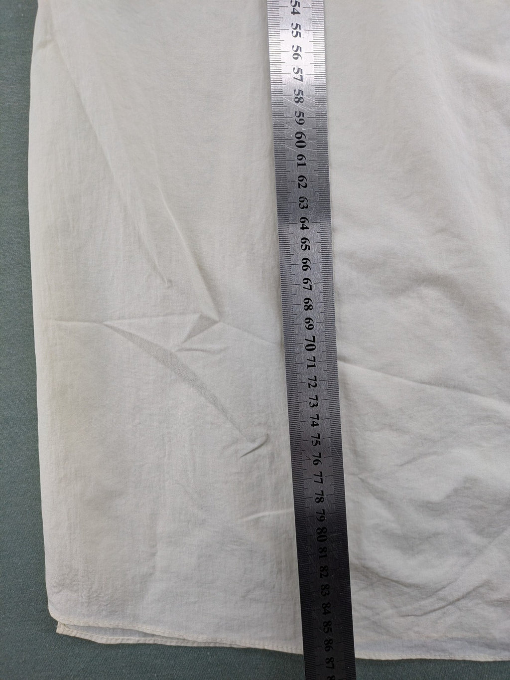 Zara cream tank top, sleeveless design, smooth polyamide fabric, minimalist style.