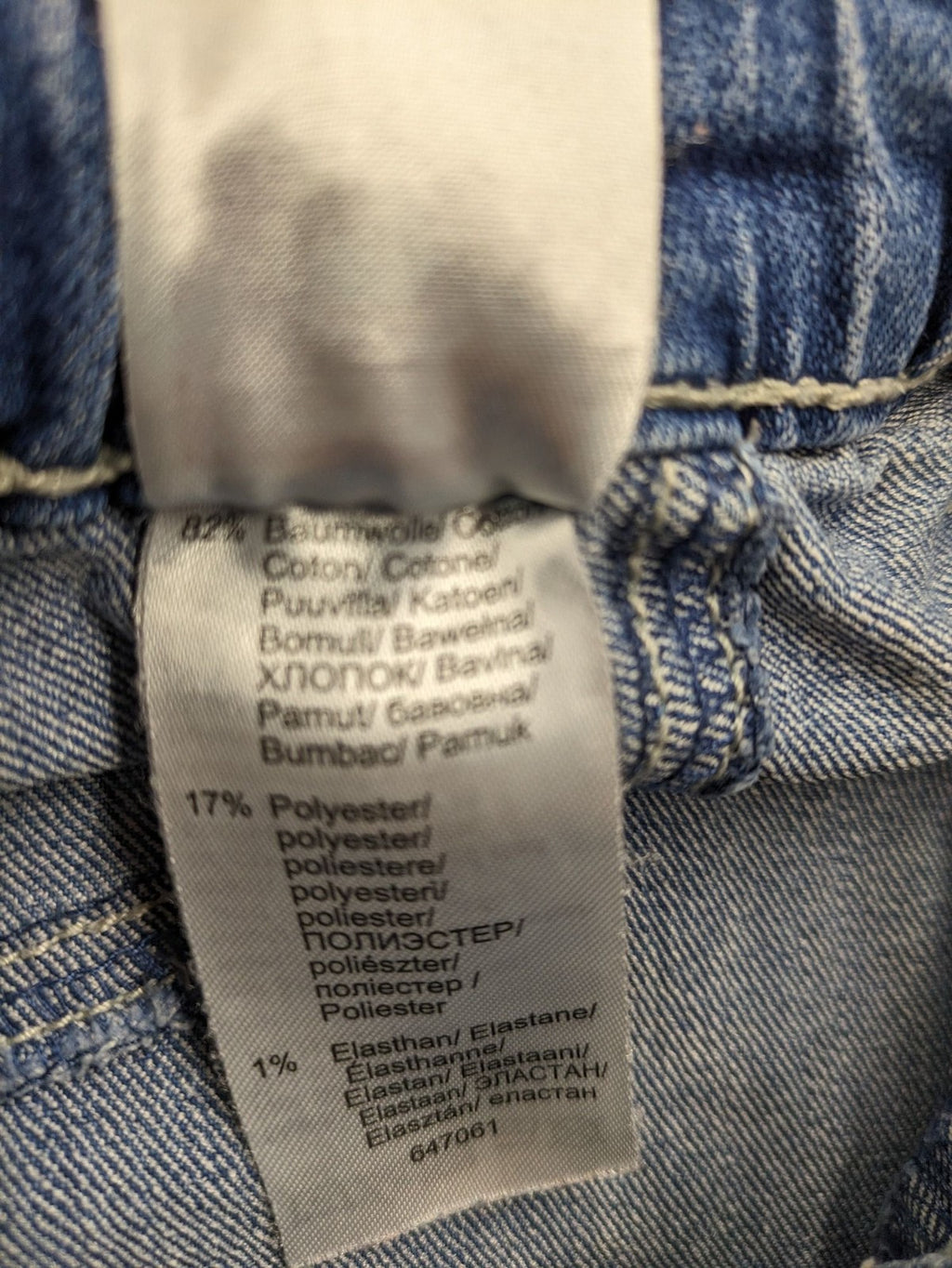 Rainbow blue straight jeans with elastic waistband and decorative knee stitching.