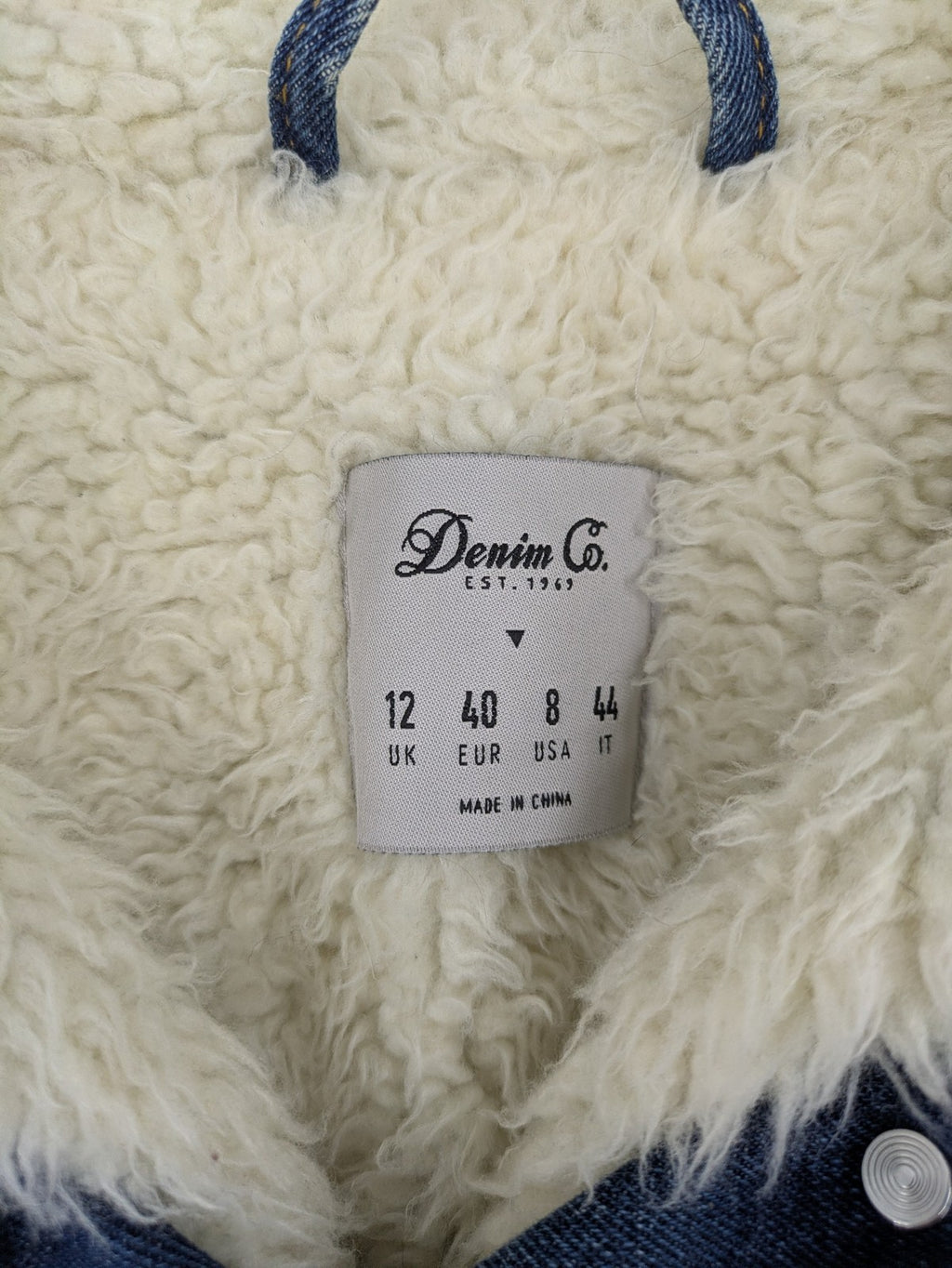 Denim & Co. blue jacket with cream Sherpa lining, button closure, and pockets.