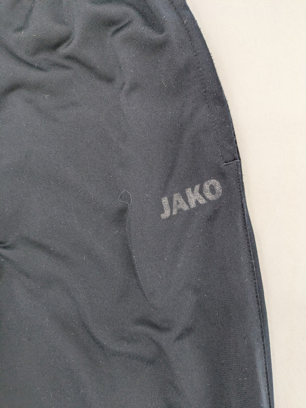 Jako black jogging pants with elastic waistband and ribbed ankle cuffs.