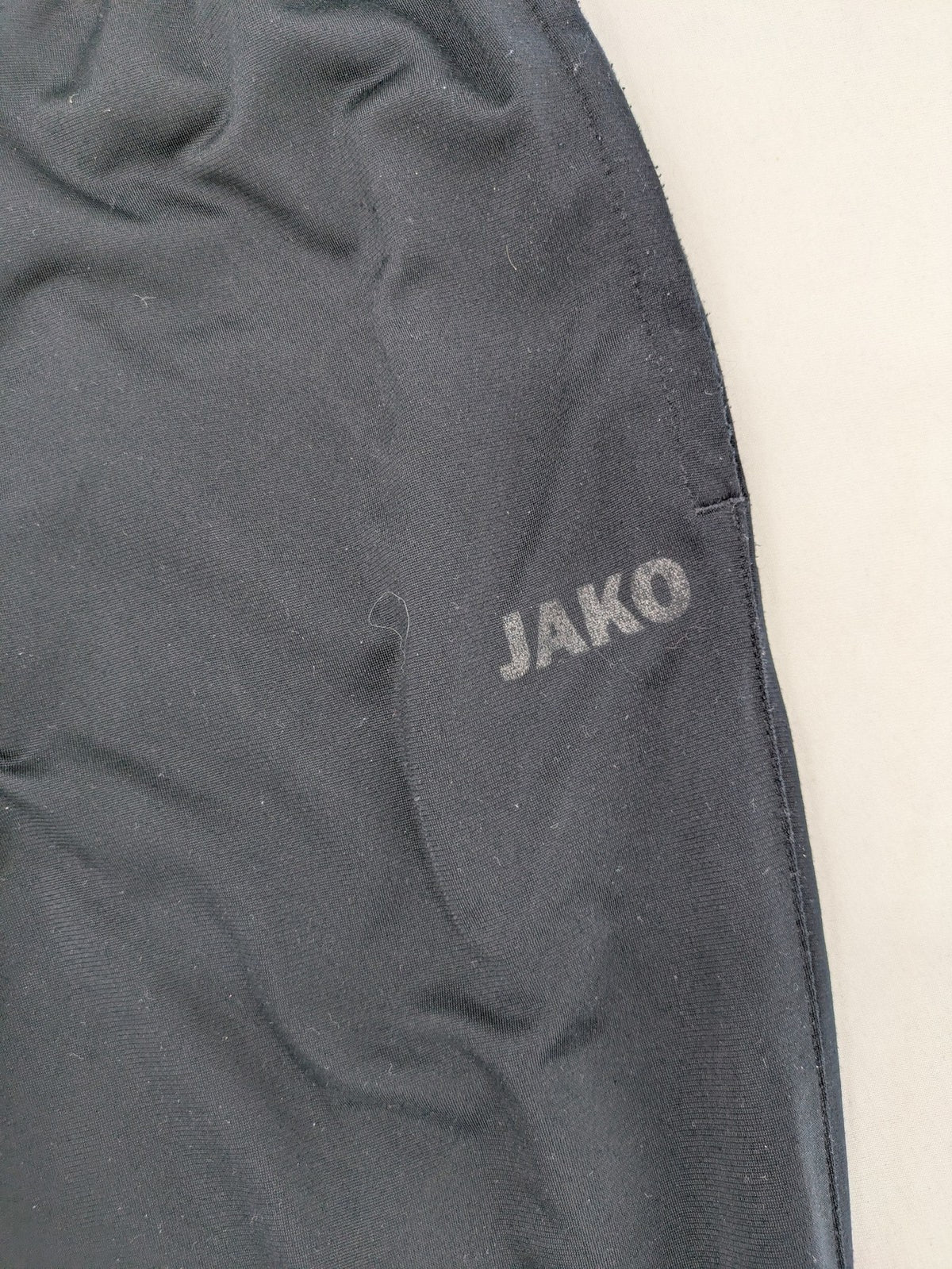 Jako black jogging pants with elastic waistband and ribbed ankle cuffs.