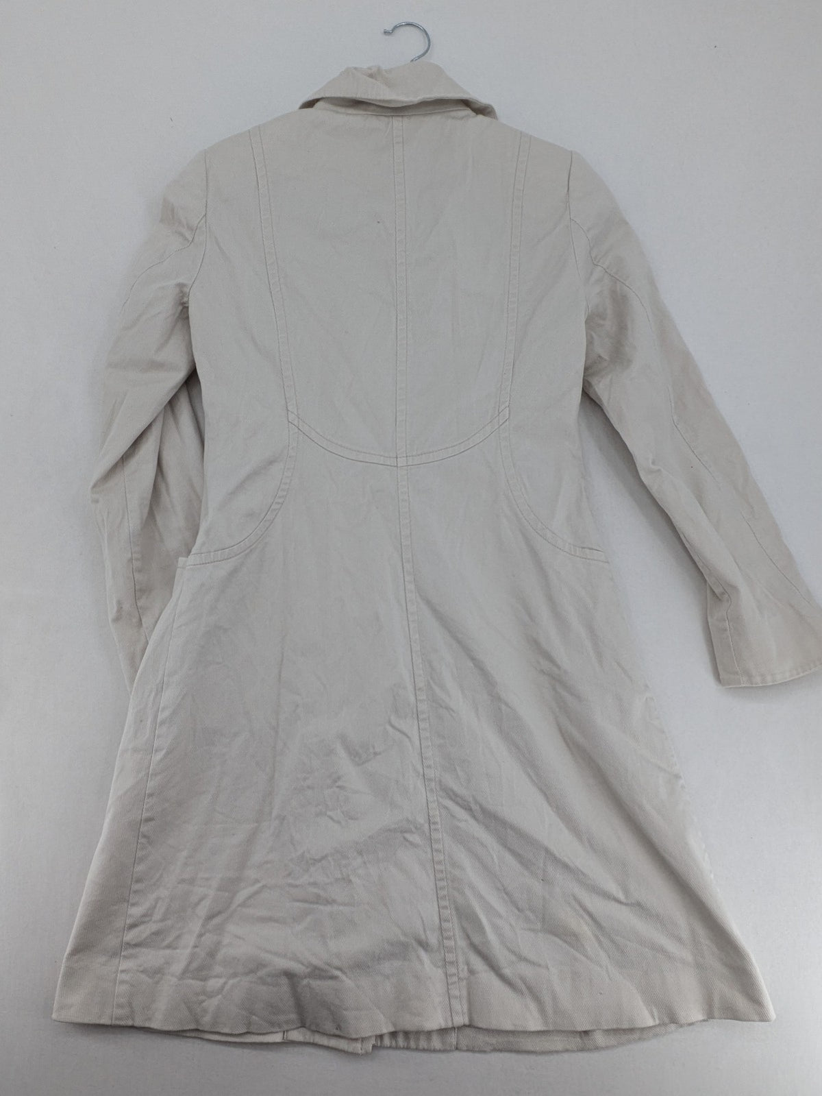 H&M beige trench coat size 38, classic design with button closure and striped lining.