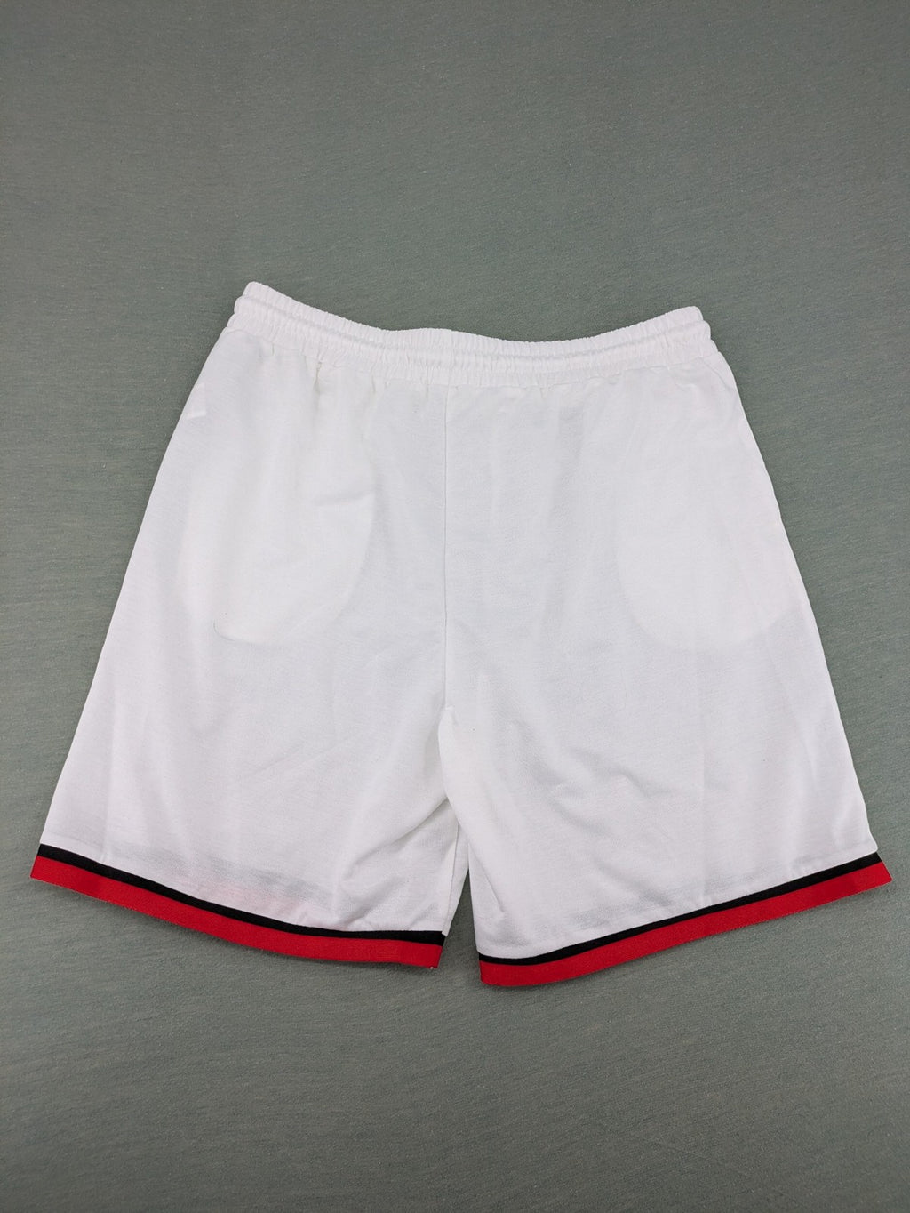 Manfinity black and white outfit set with red accents and "Freedom" graphic print.
