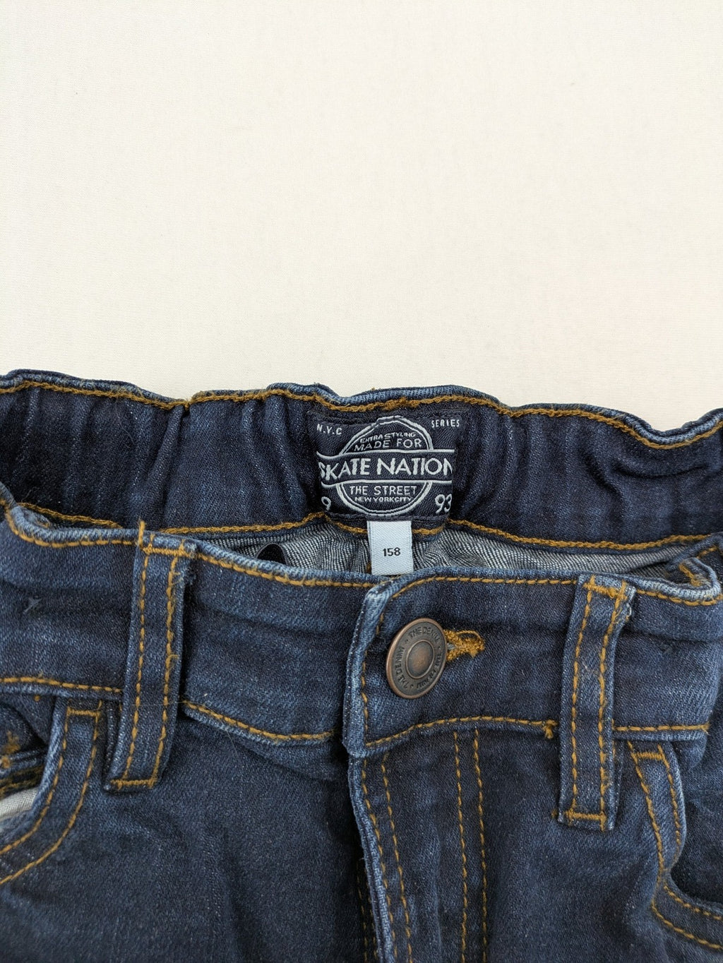 Skate Nation blue straight jeans 5-pocket design with adjustable waistband and dark wash.