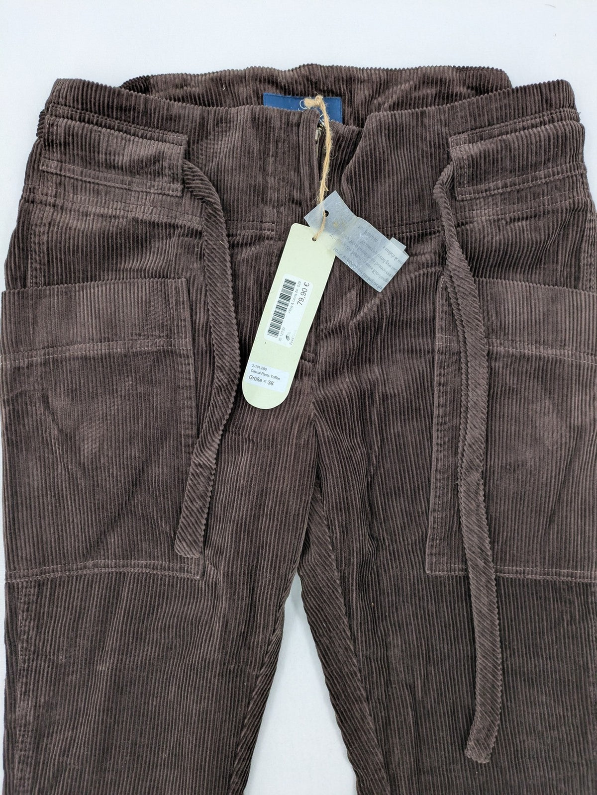 Alma & Lovis brown cord pants with drawstring, casual fit, and patch pockets.