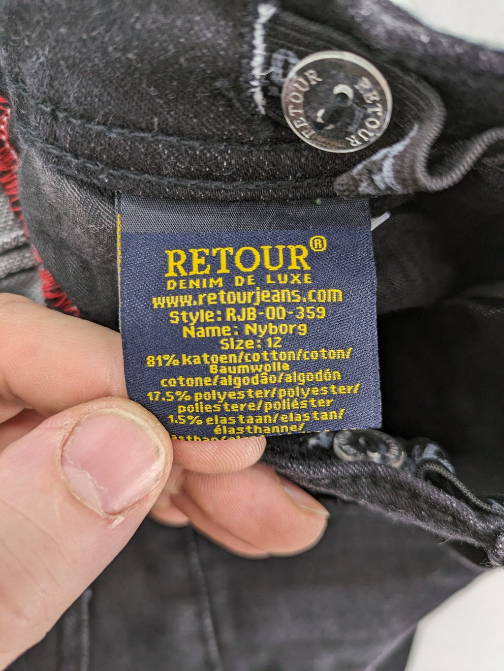 Skinny black straight jeans with distressed details and logo, made from durable denim.
