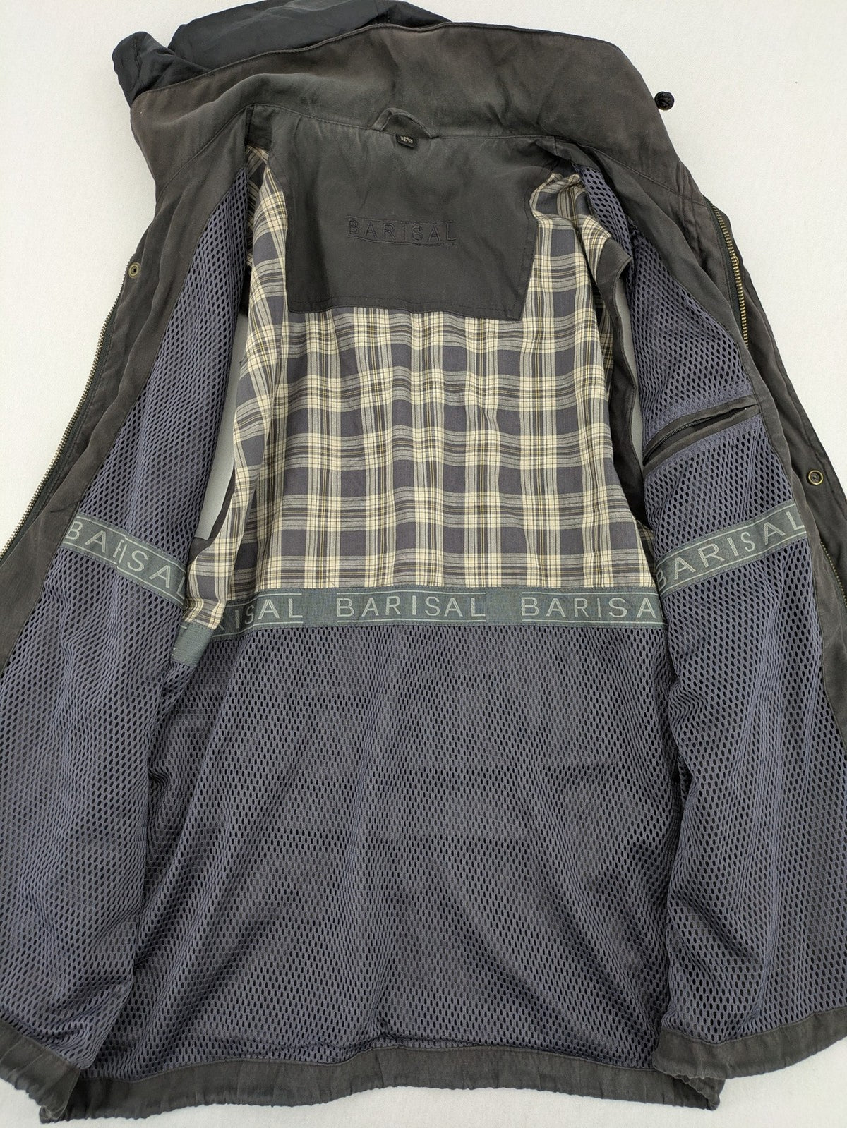 Barisal grey coat with hood, cargo pockets, and checkered lining detail.