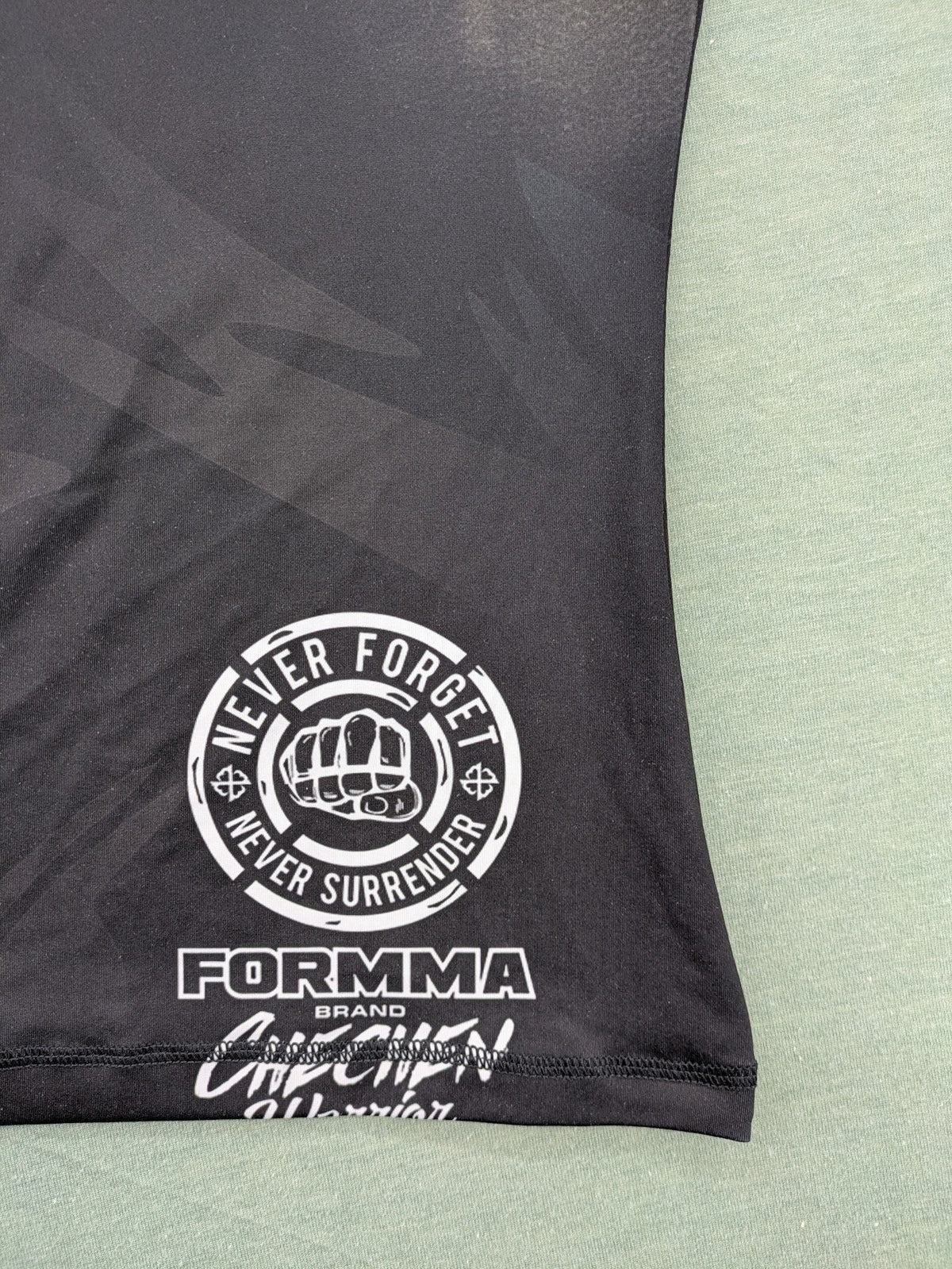 FORMMMA black rashguard featuring striking white wolf graphic and "Chechen Warrior" text.