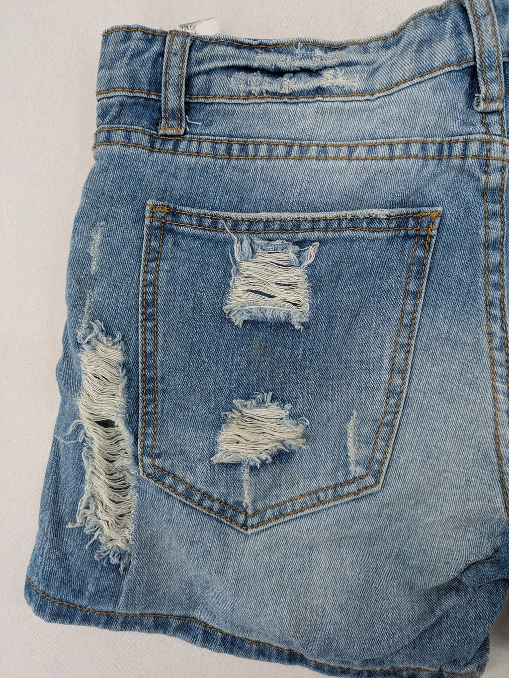 Daysie blue boyfriend jeans shorts with distressed rips and classic 5-pocket design.