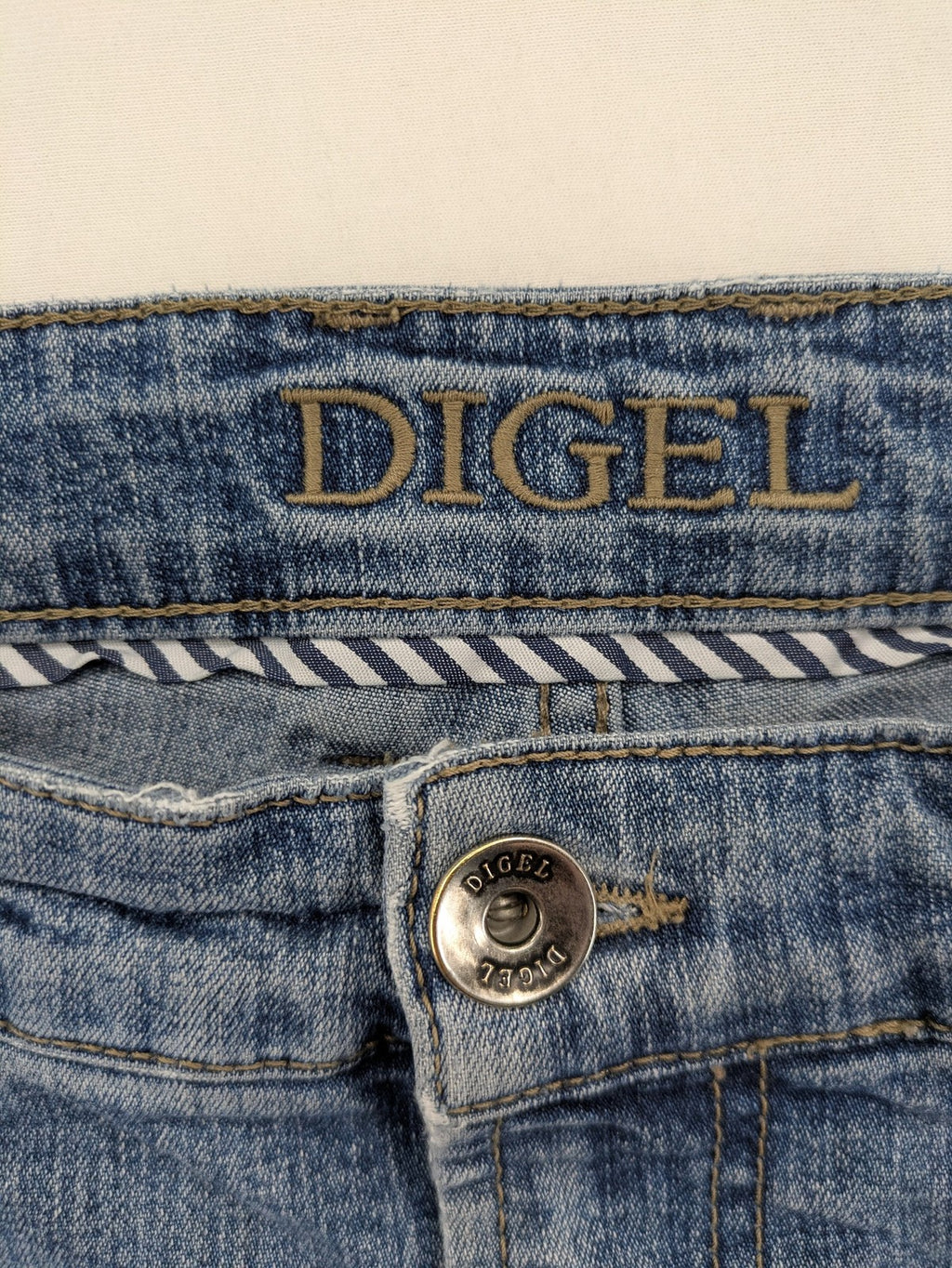 Digel blue straight jeans with classic medium wash and durable cotton denim material.