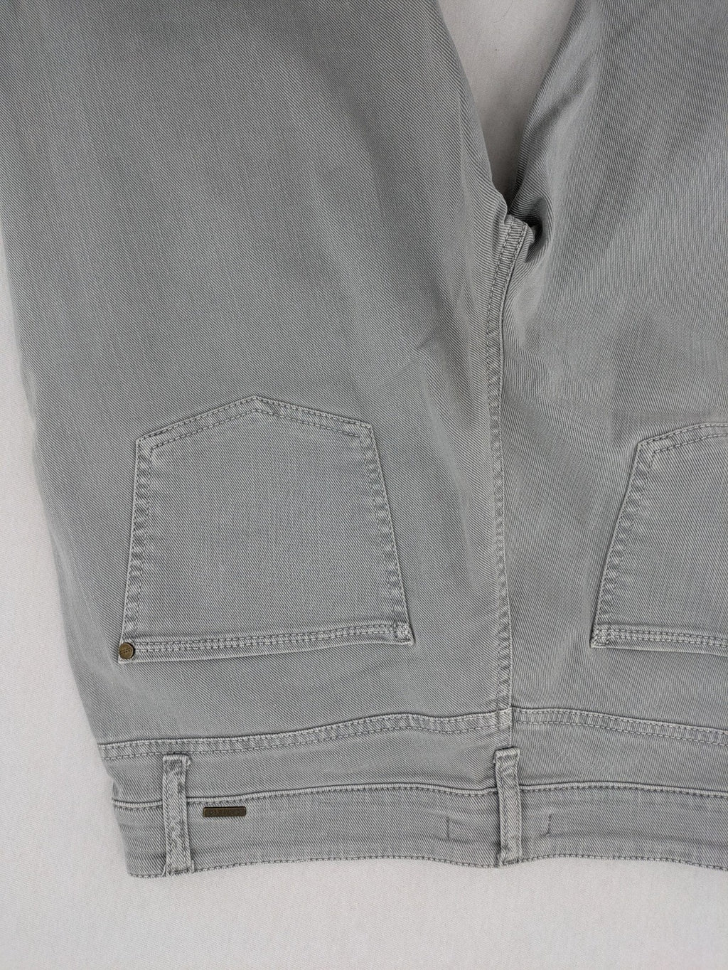 Cambio grey straight leg jeans with five-pocket design and logo button closure.