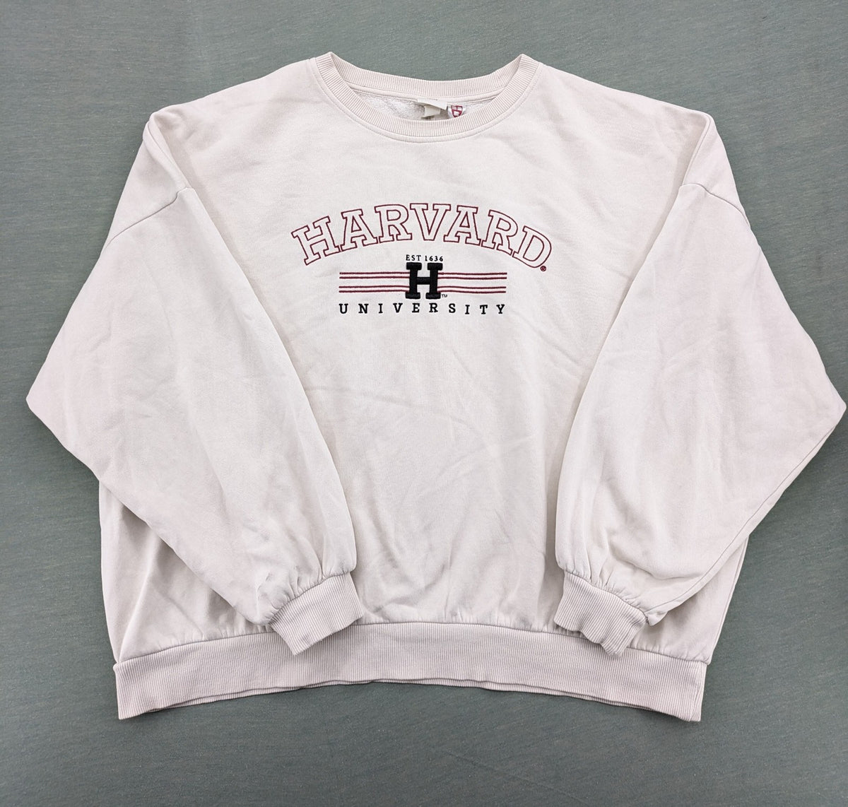H&M cream turtle neck jumper embroidered Harvard University logo, soft cotton blend.