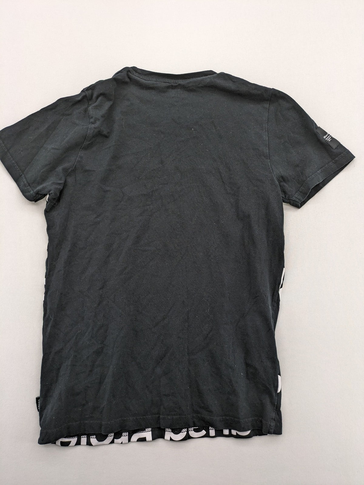 Black Squad black t-shirt all-over graphic print with logo patch on sleeve.