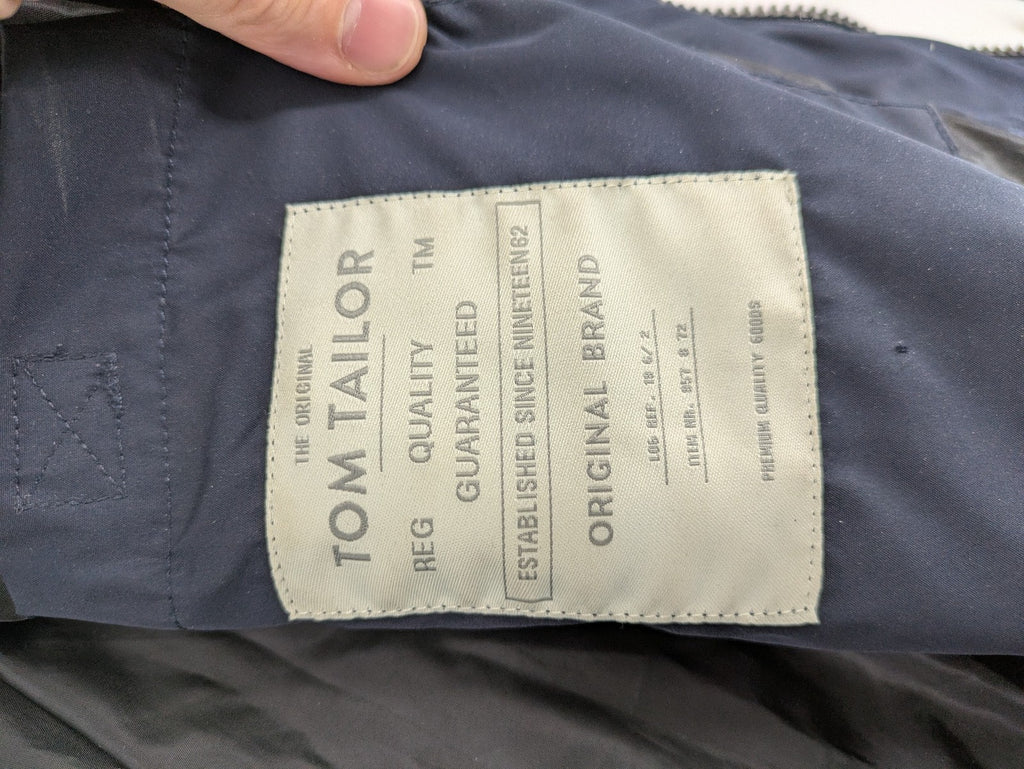 Tom Tailor navy puffer jacket with quilted design and adjustable hood, featuring multiple pockets.