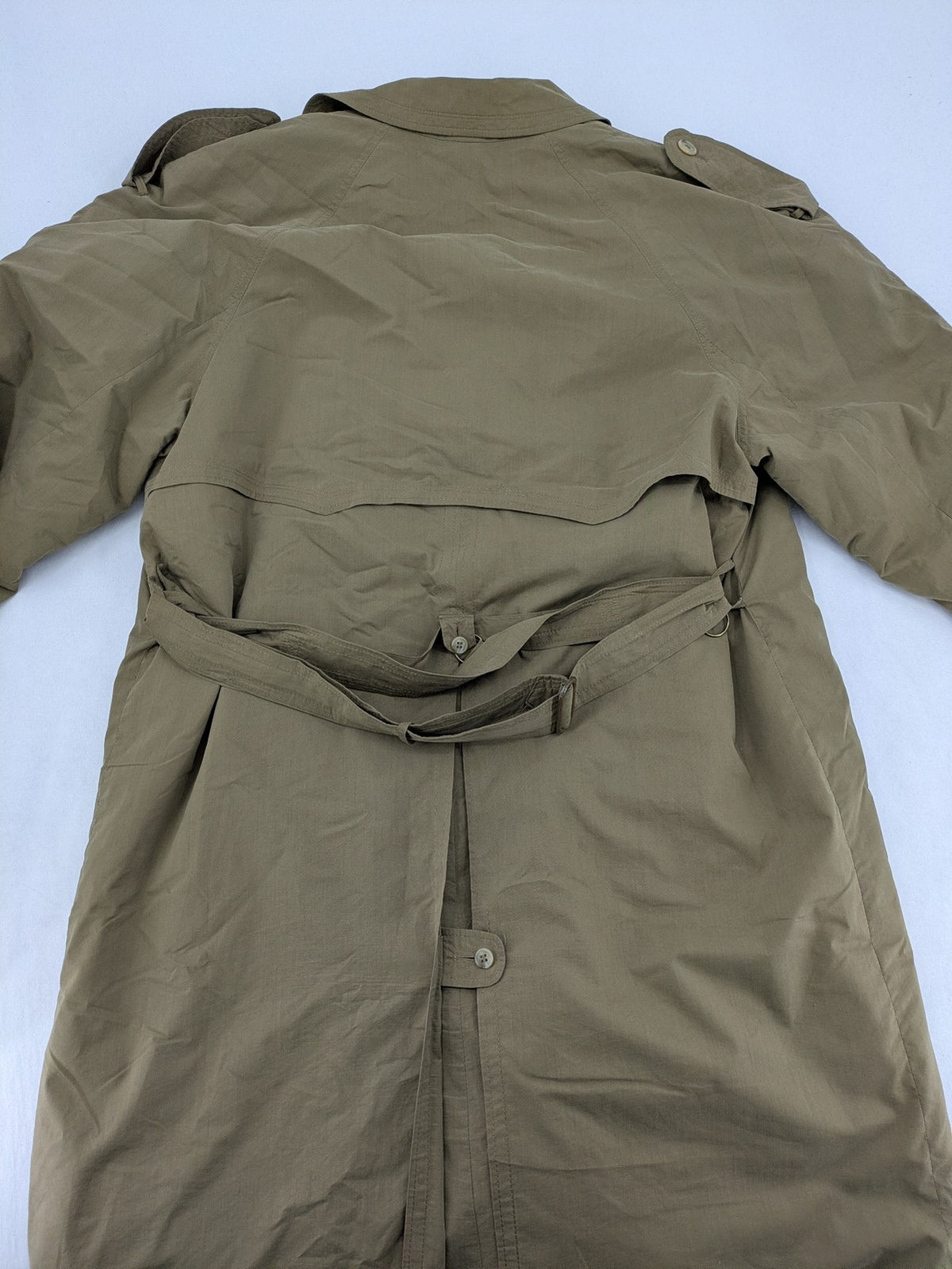 Studio Novum khaki trench coat double-breasted design with belt and wool lining.