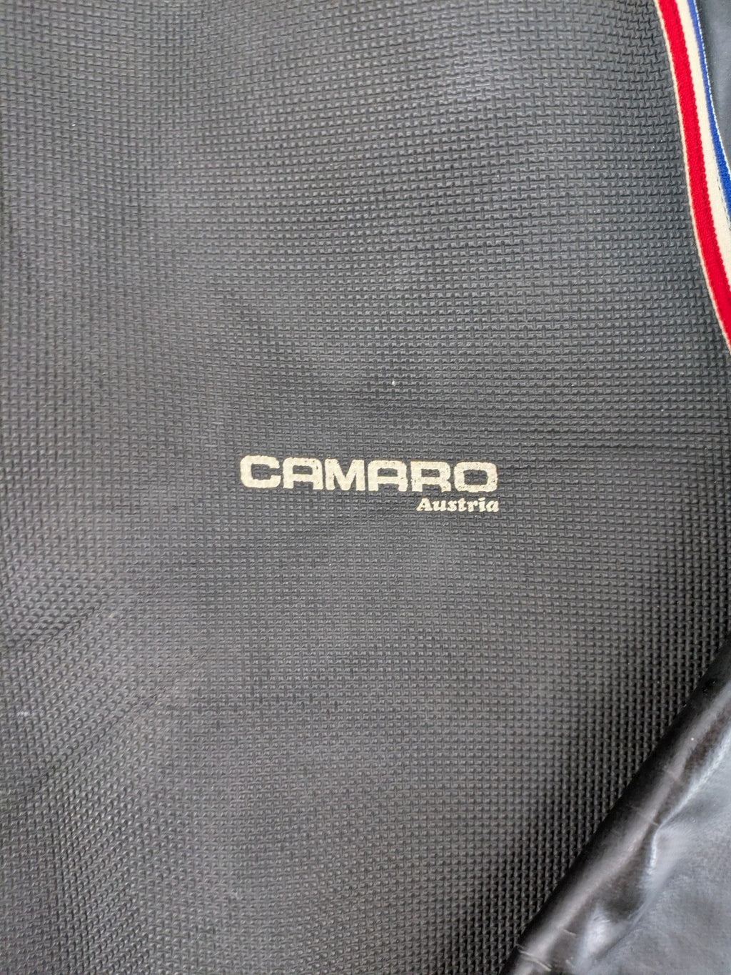 Camaro vintage jacket multi-colour with striped accents and structured body.