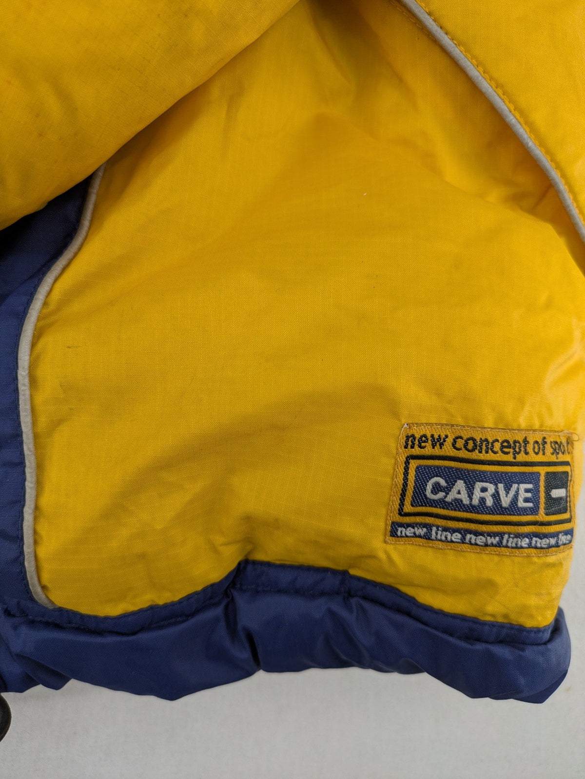 Shamp navy and yellow vintage ski jacket and pants set with retro design.
