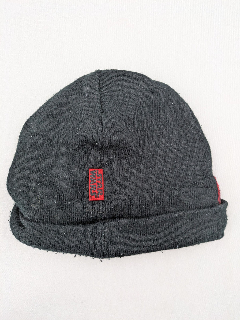 Star Wars black and red reversible beanie featuring Chewbacca graphic and logo.