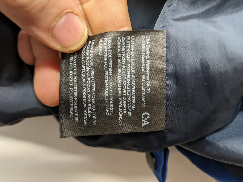 C&A blue winter jacket with hood, zip closure, and multiple pockets, used condition.