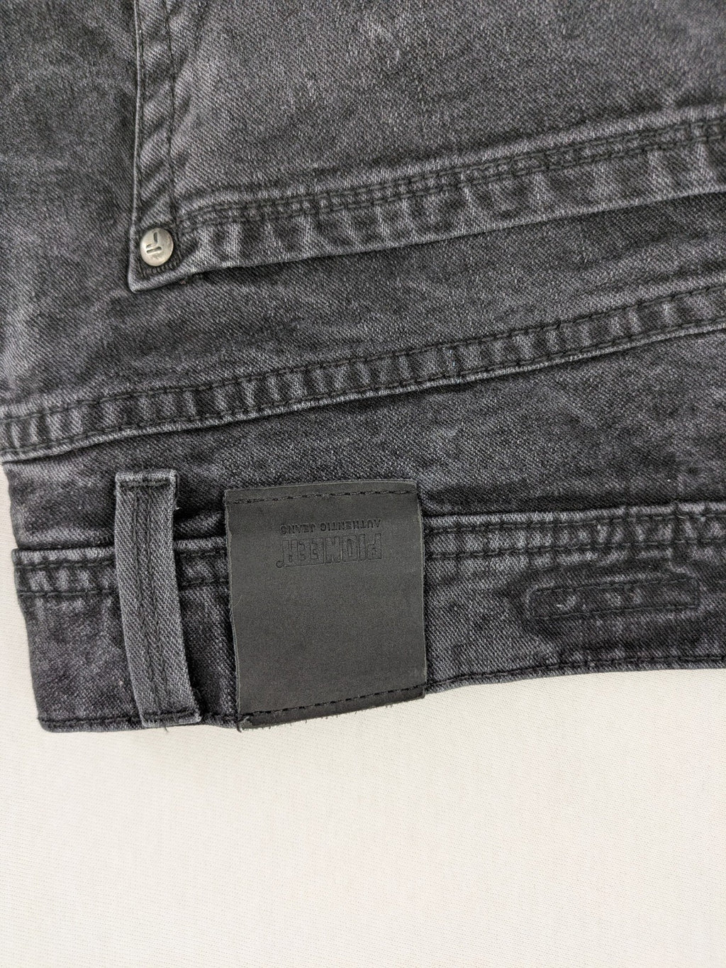 Pioneer grey straight jeans with washed finish and stretch material, classic design.
