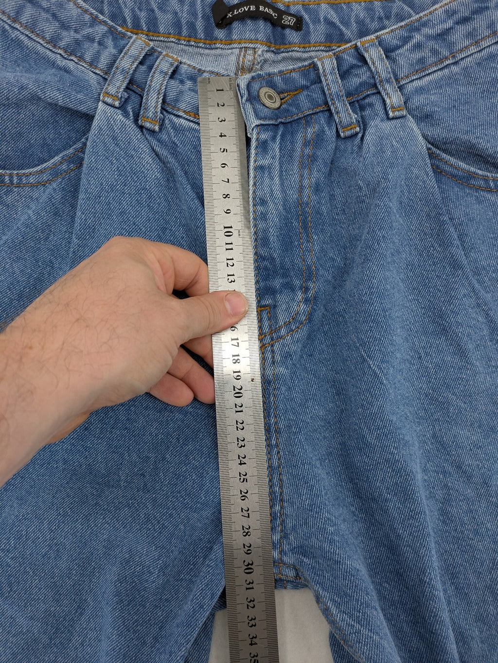 X.LOVE blue high waist wide leg jeans with front pleats and frayed hem.