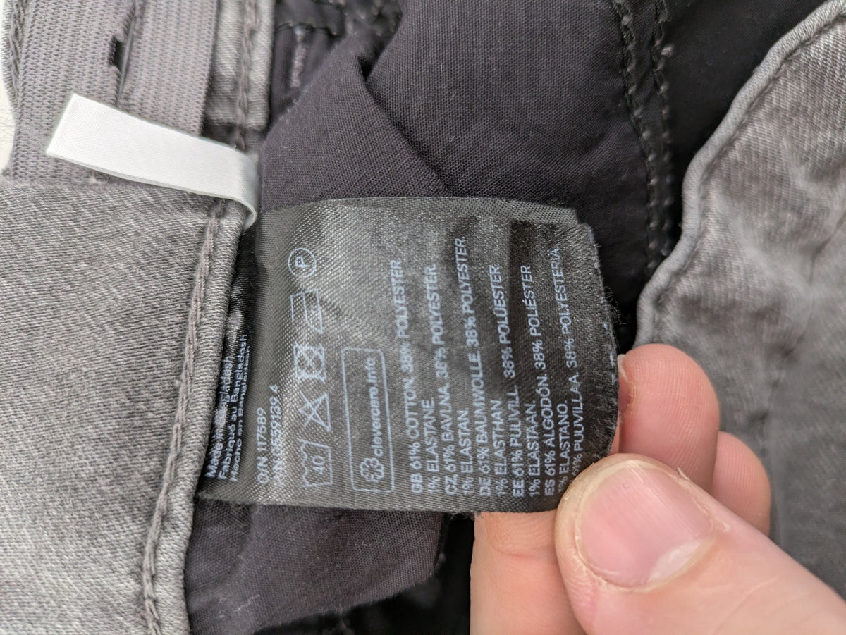 H&M grey jogger jeans with elastic waistband and drawstring, stylish washed look.
