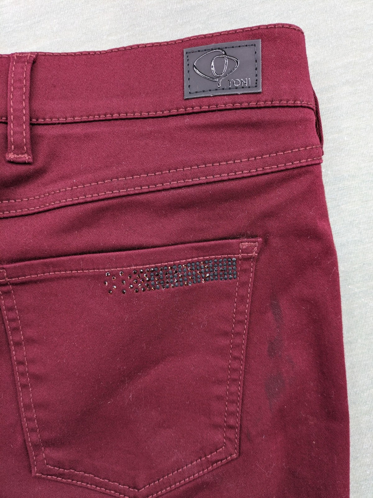 TONI burgundy straight jeans CS-Slim-Fit with subtle rhinestone detail on pocket.