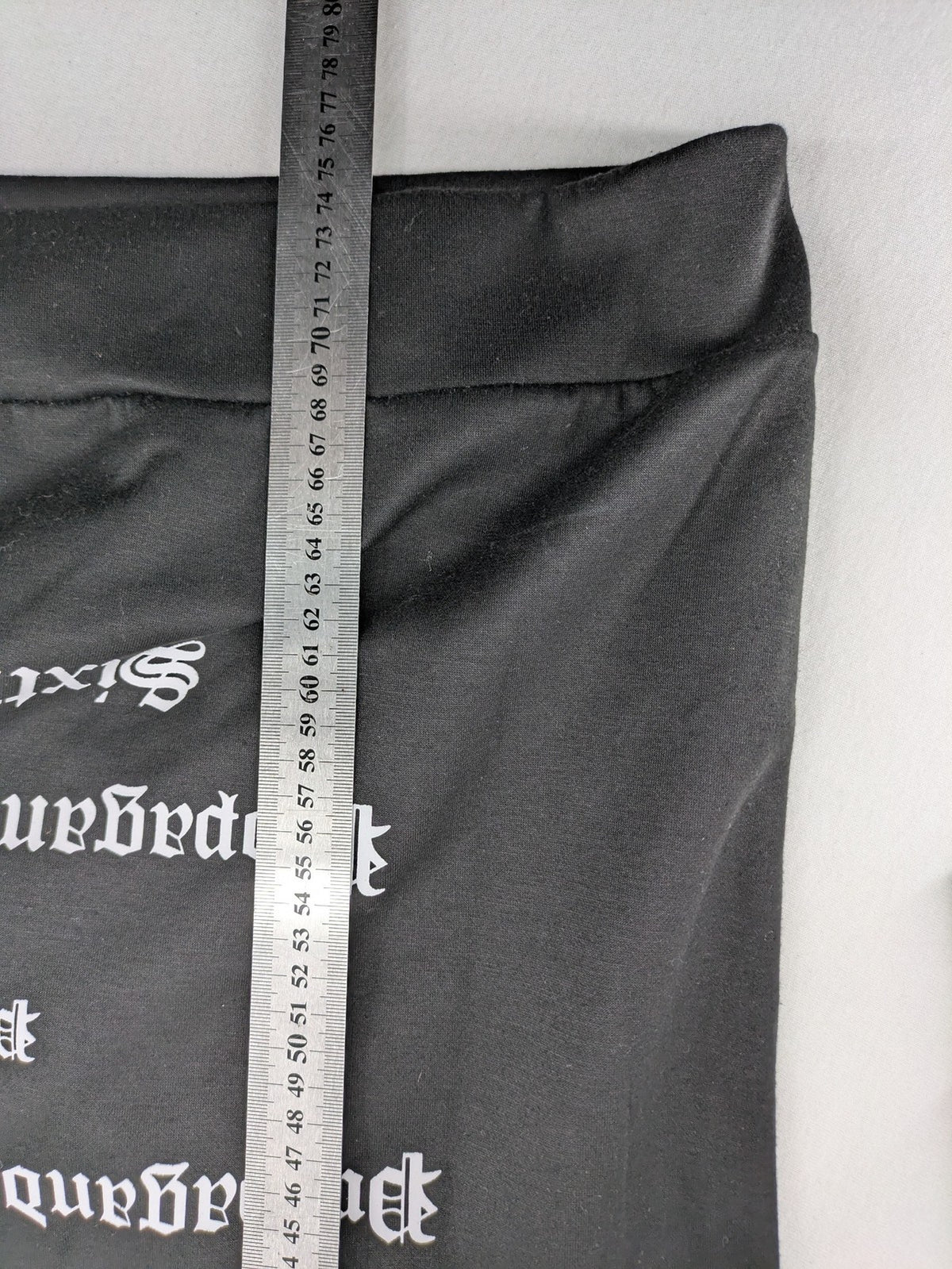 Sixth June black sweatshirt with Gothic "Propaganda" graphic print and logo details.