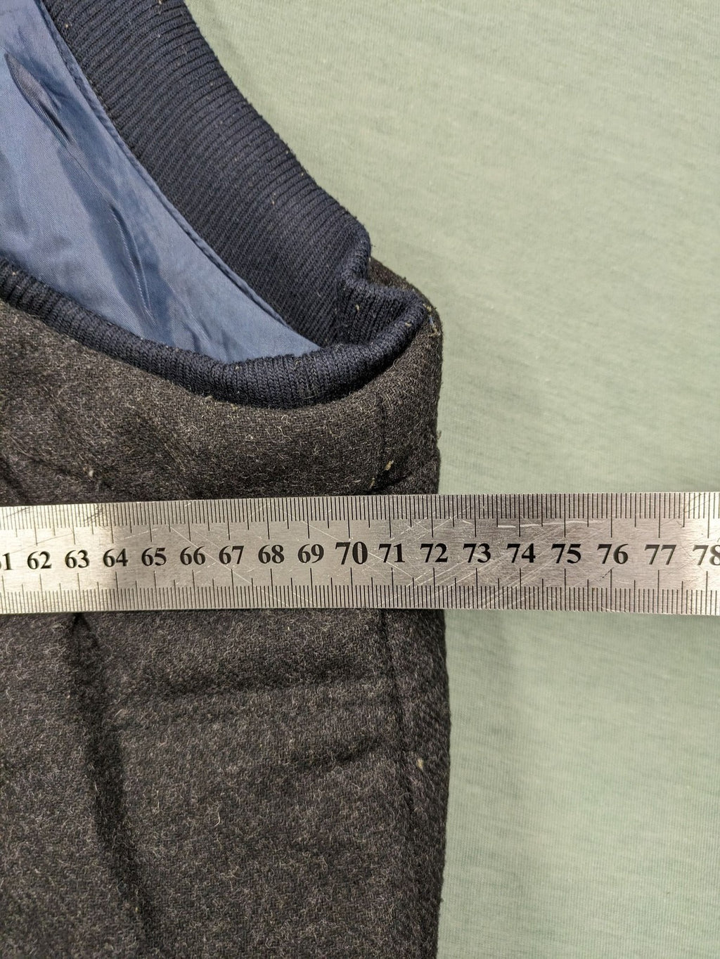 Men Plus grey and navy quilted vest with full zip and snap button placket.