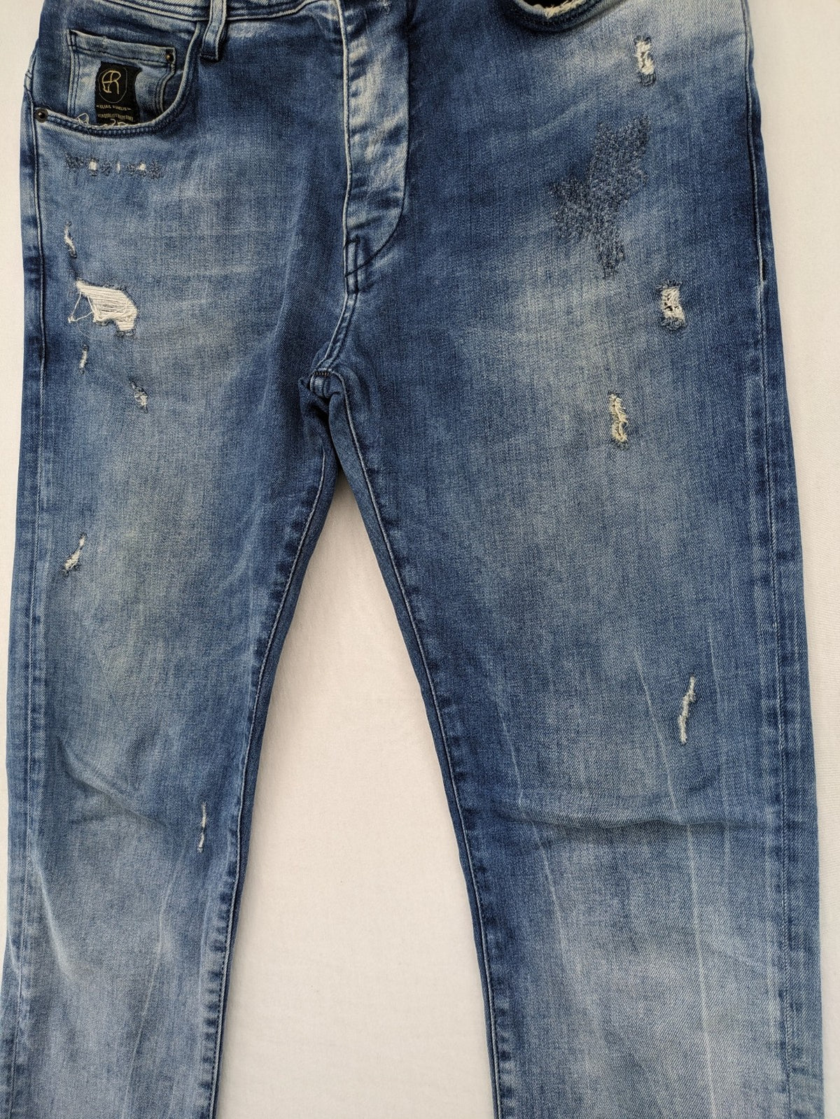 W32 blue straight jeans distressed details tapered fit button fly design