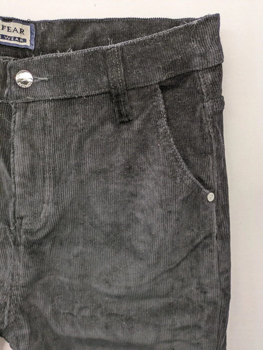 Tomfear black straight fit cord jeans, classic five-pocket design, soft corduroy material.