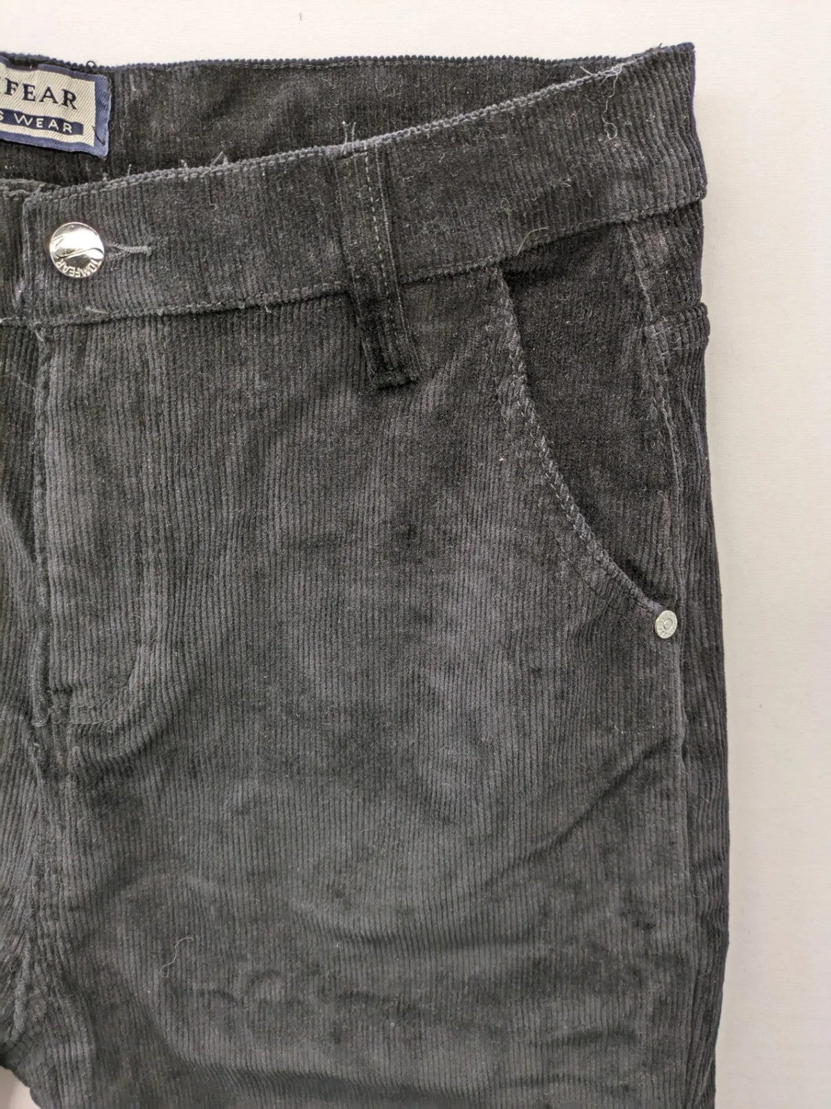Tomfear black straight fit cord jeans, classic five-pocket design, soft corduroy material.