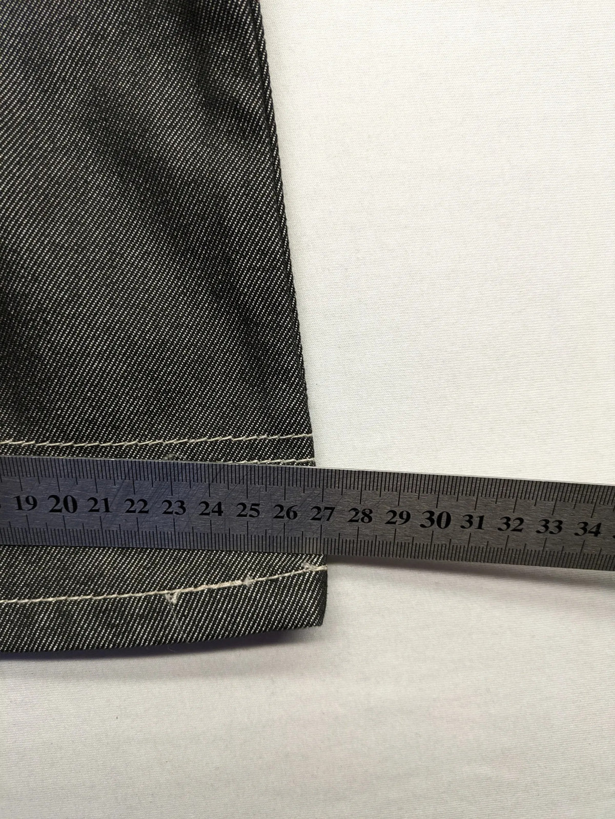 CIPO grey bootcut biker jeans with white contrast stitching and moto-inspired knee pleats.