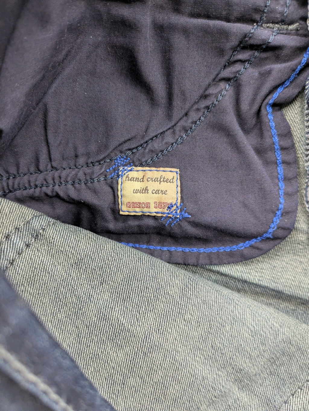 Mac Jeans blue straight jeans dark wash with subtle fading and stretch denim material.