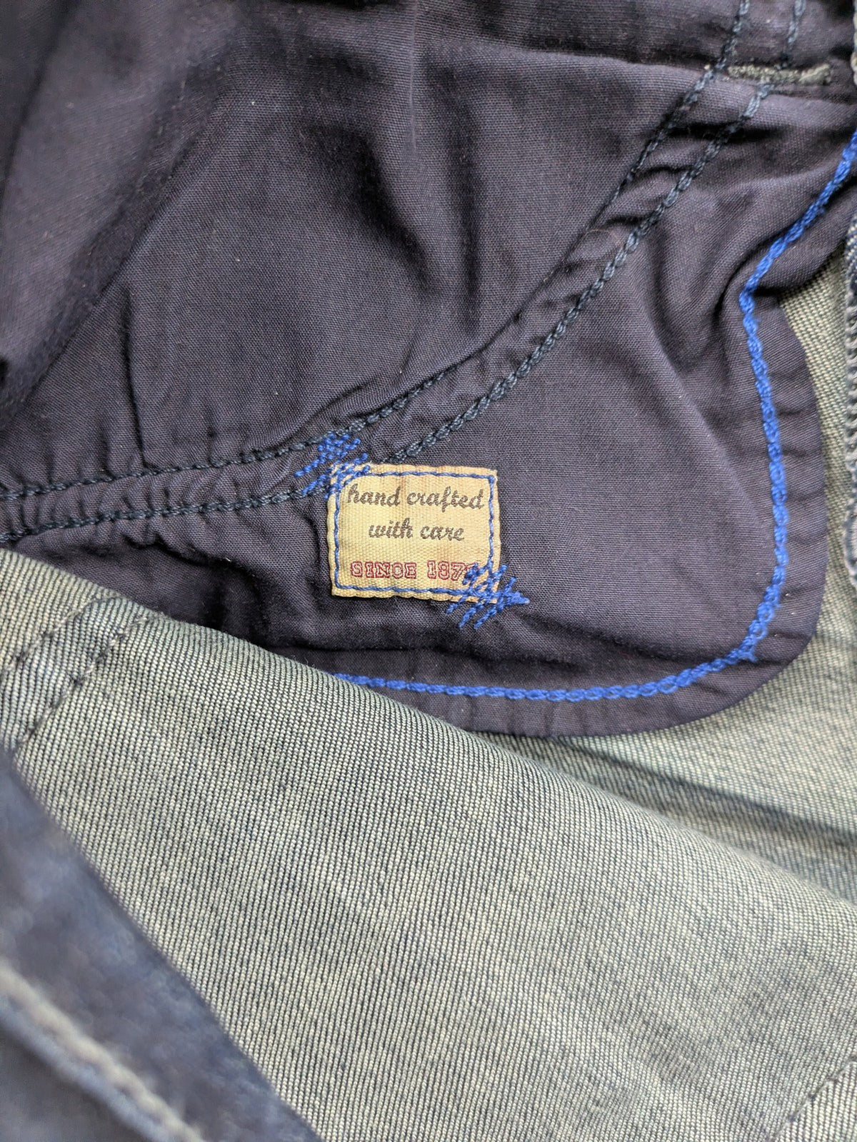 Mac Jeans blue straight jeans dark wash with subtle fading and stretch denim material.