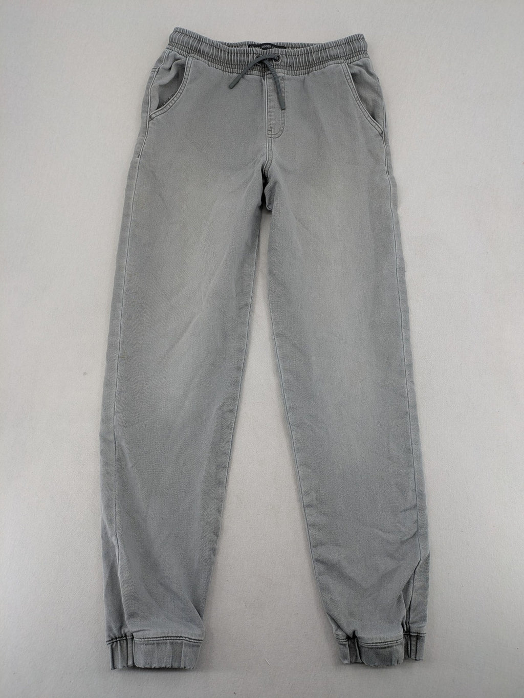 Denim & Co. grey jogger jeans with elastic waistband and ankle cuffs, cotton material.