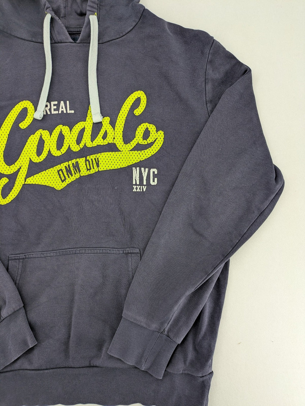 Angelo Litrico grey hoodie with neon green 'Real Goods Co NYC' graphic print and kangaroo pocket.