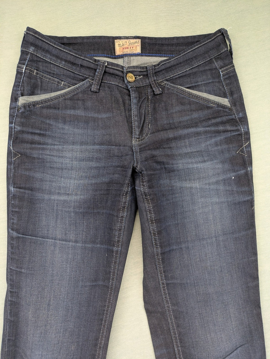 Mac Jeans blue straight jeans dark wash with subtle fading and stretch denim material.