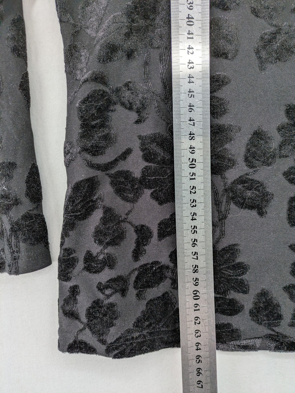 TCM black long sleeve top with floral flock print on sheer fabric.
