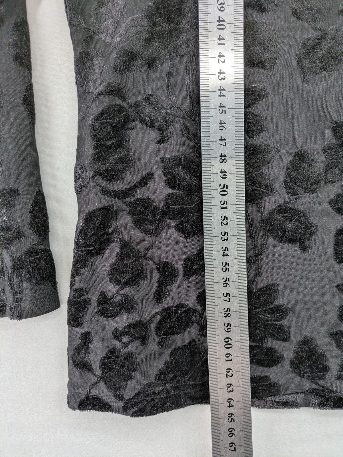 TCM black long sleeve top with floral flock print on sheer fabric.