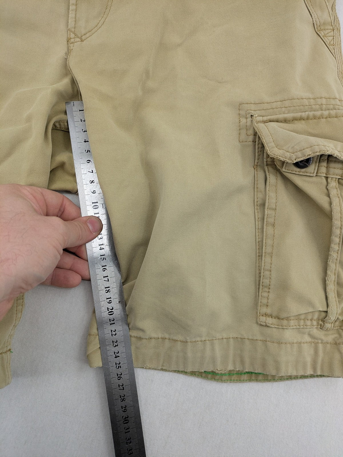 Angelo Litrico beige cargo shorts with multiple pockets and durable cotton material.