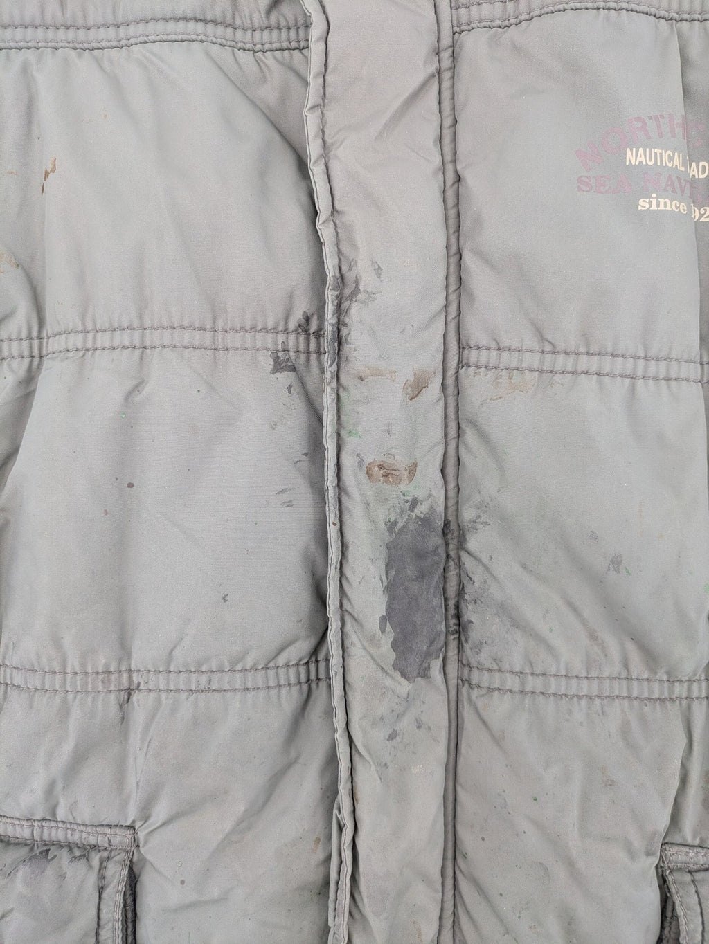 Camargue grey quilted jacket with fleece collar and buttoned pockets.