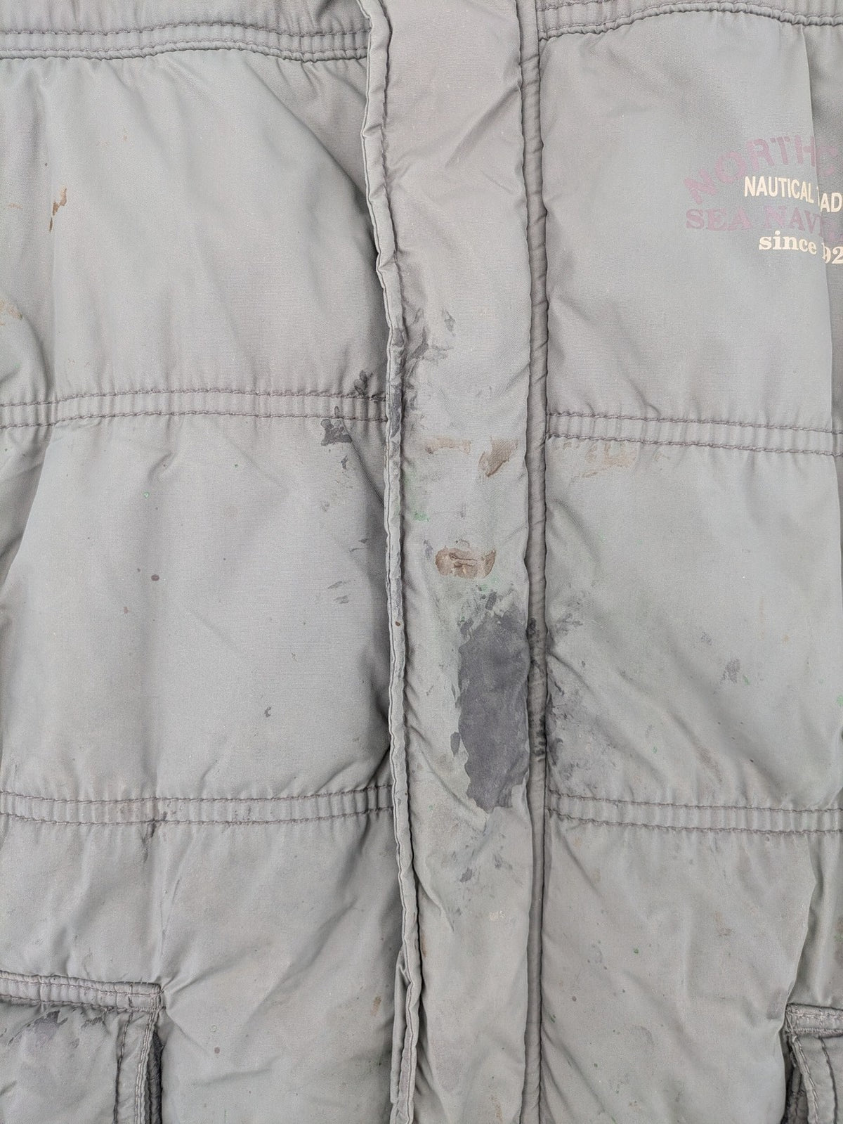 Camargue grey quilted jacket with fleece collar and buttoned pockets.