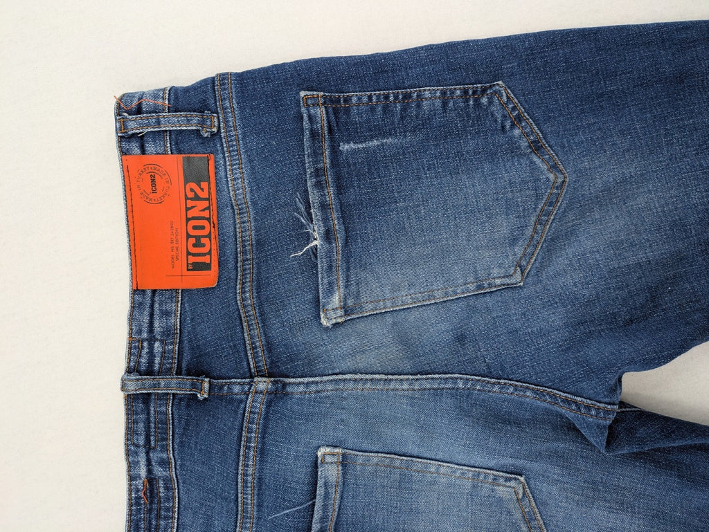 ICON 2 blue slim fit jeans distressed stretch denim with button fly and faded details.
