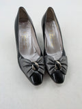 Bruno Magli black high heels leather with grey bow detail and classic silhouette.